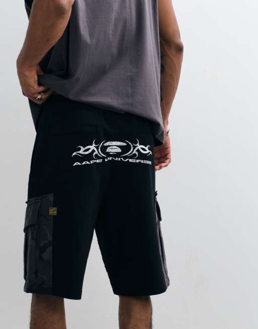 Aape by A Bathing Ape - Pantaloncini neri in jersey ampi con tasche mimetiche, 2 di 5