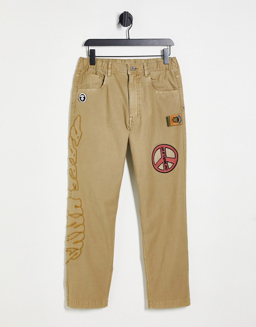 AAPE BY A BATHING APE® Aape By A Bathing Ape peace chino pants in