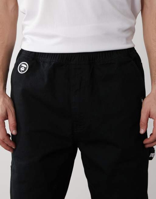 Aape by A Bathing Ape pull on straight leg carpenter pants in black
