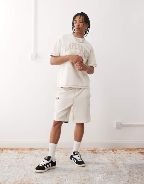 Aape by A Bathing Ape reversible logo sweatshirt fabric shorts in off white - view 1