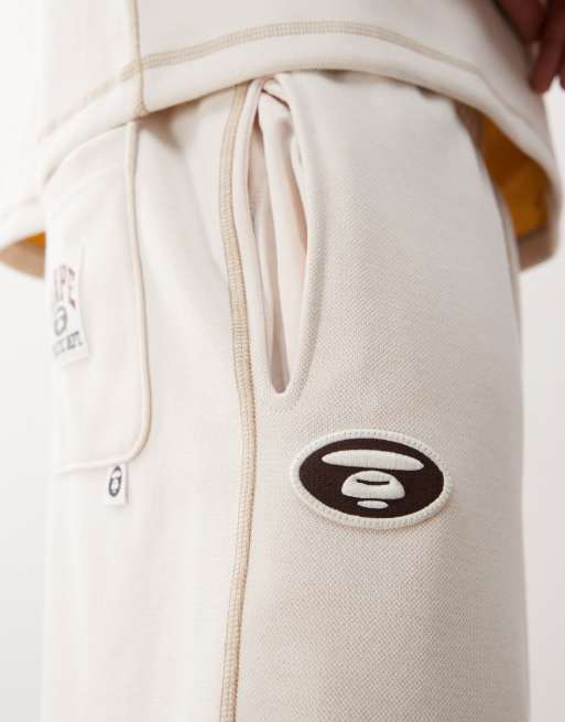 Aape by A Bathing Ape reversible logo sweatshirt fabric shorts in off white, 4 of 5