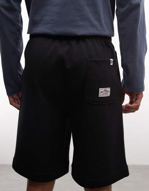 Aape by A Bathing Ape reversible loose fit jersey shorts in black and blue, 2 of 5