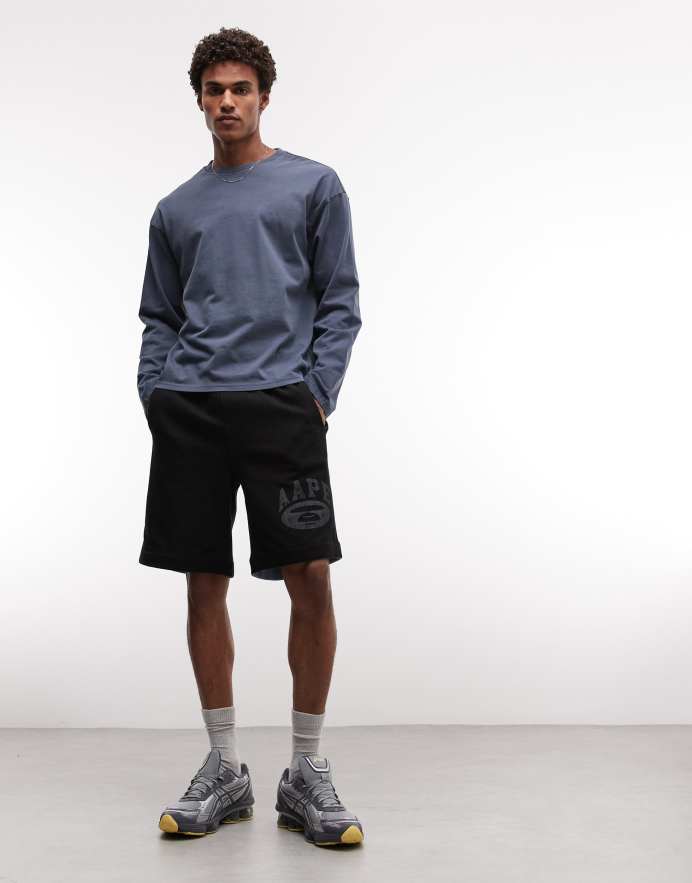 Aape By A Bathing Ape® shorts de punto reversibles de corte holgado en negro y azul