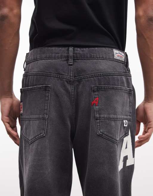 Aape by A Bathing Ape - Sorte forvaskede og løstsiddende denimjeans med logoprint, 4 af 5