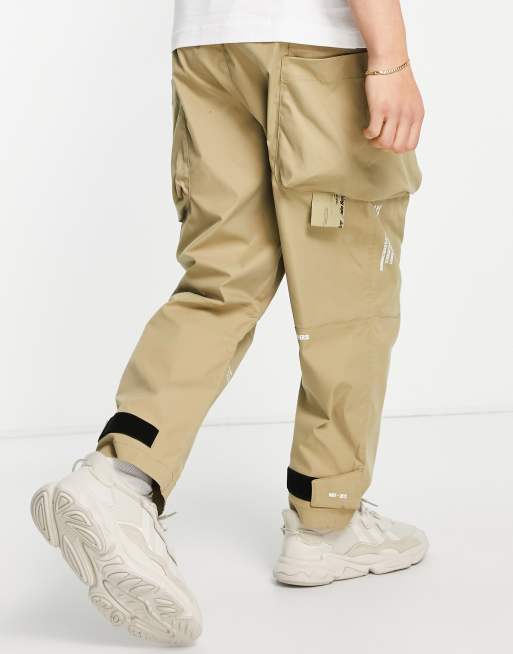 AAPE by A Bathing Ape super loose fit cargo pants in beige | ASOS