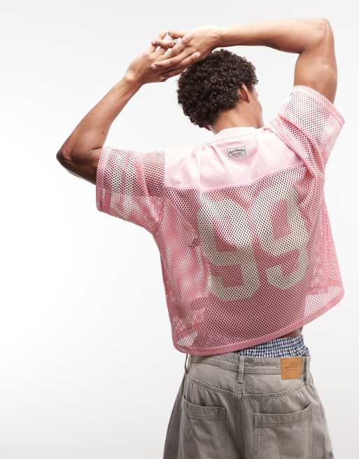 AAPE BY A BATHING APE - top de malla oversize rosa con estampados de logotipos múltiples
