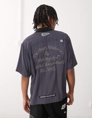 AAPE BY A BATHING APE® Aape by A Bathing Ape worker short sleeve shirt in dark grey with back embroidery