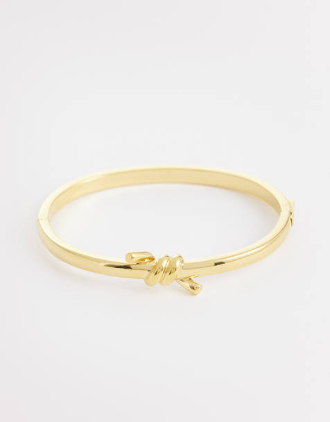 Abbott Lyon twisted knot bangle in 18k plated stainless steel in gold - view 1