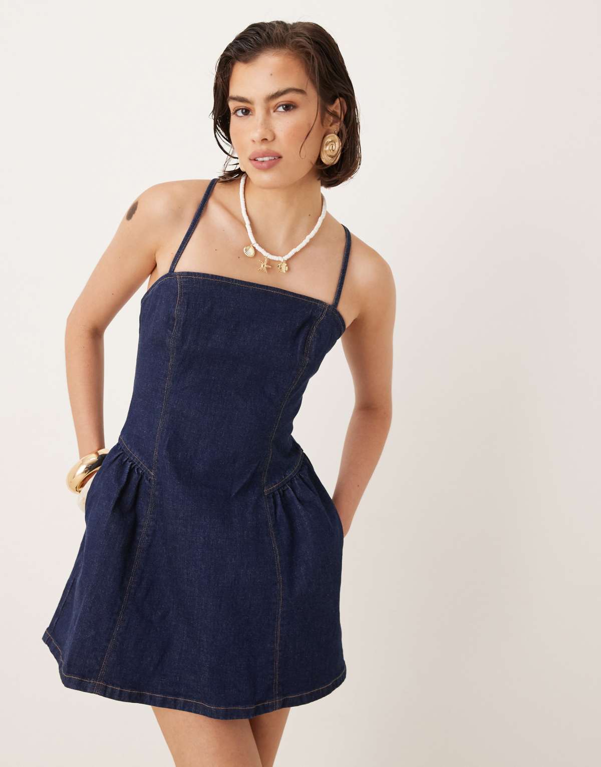 Abercrombie & Fitch dipped waist cross back denim mini dress in indigo wash
