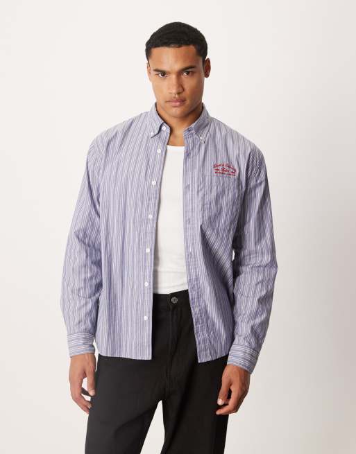 Abercrombie & Fitch - Gestreept preppy overhemd met lange mouwen en print op de borst in blauw