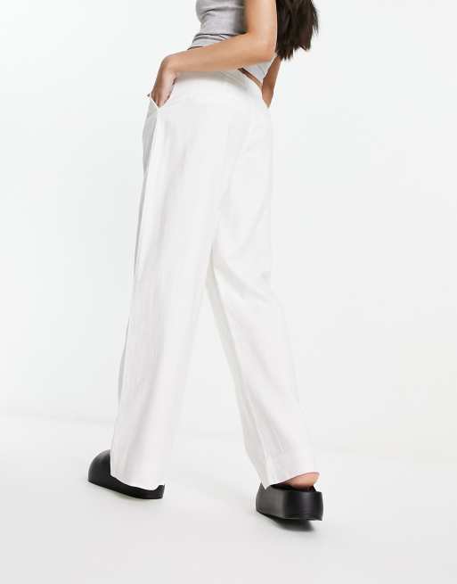 White fitted shop trousers