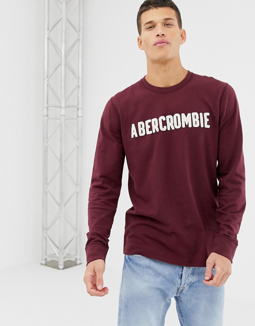 Abercrombie & Fitch logo applique long sleeve top in burgundy-Red