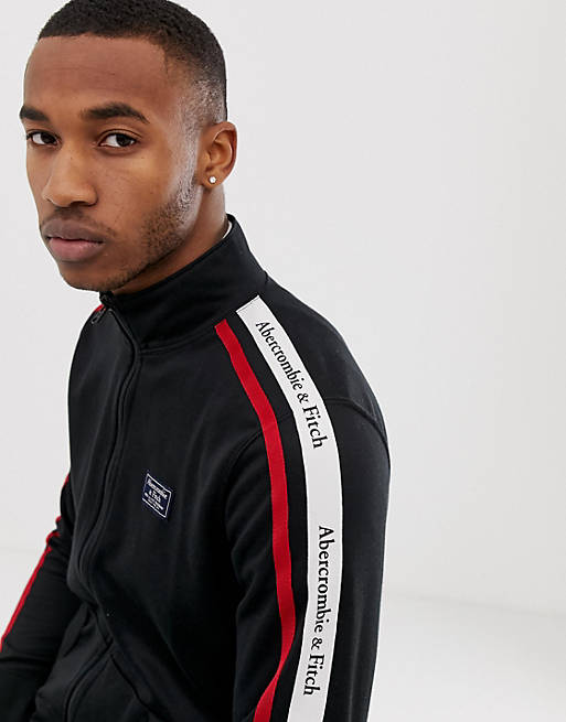 Abercrombie & Fitch logo tape sleeve tricot track jacket in black | ASOS