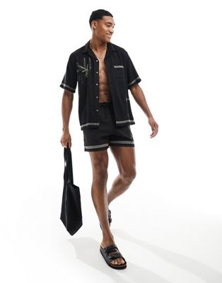 Abercrombie & Fitch martini embroidered 5in pull on seersucker swim shorts in black co-ord