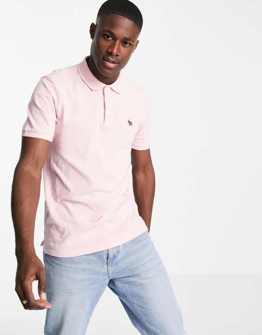 Abercrombie & Fitch – Pikee-Polohemd mit 3D-Logo in Rosa