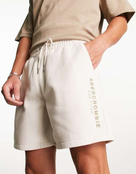 Abercrombie & Fitch – Ściągane na sznurek beżowe szorty z haftowanym logo - view 1
