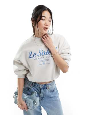 Abercrombie & Fitch - Sweatshirt met geborduurd en geprint motief op de borst in zandkleur