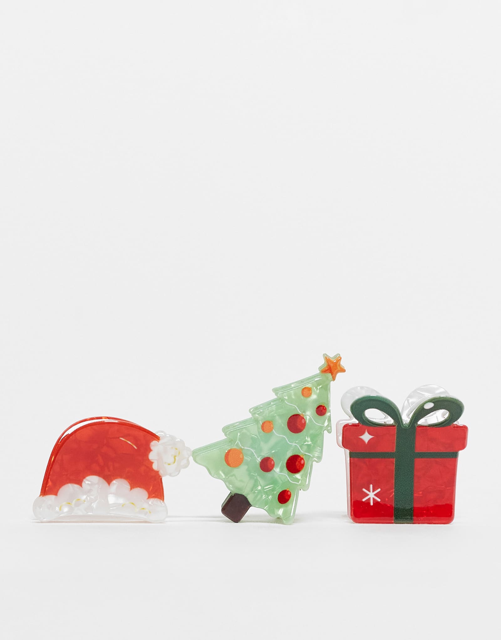 Дополните аксессуарами 3 упаковки рождественских заколок для волос в нескольких цветах.