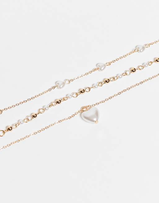 Accessorize – 3er-Pack zarte Armbänder in Goldoptik mit Kunstperlen und Herzanhänger, 2 von 3