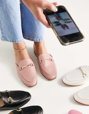 Accessorize backless loafers with snaffle in pink