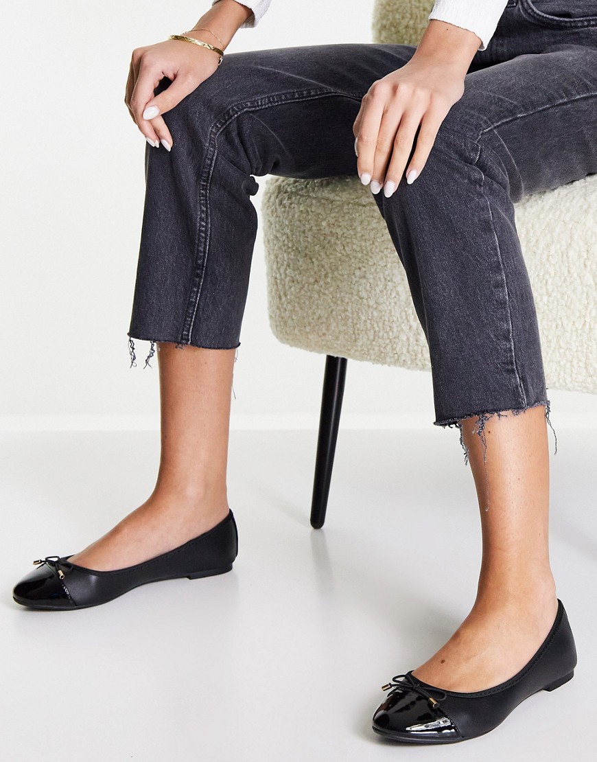 Accessorize ballet flats with contrast toe cap in black