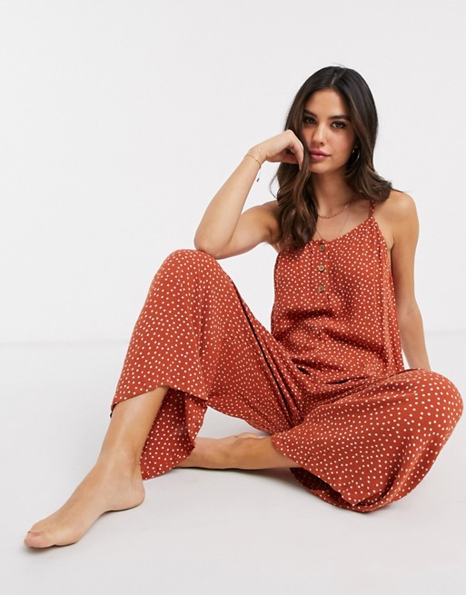 Accessorize beach jumpsuit with button detail in rust polka dot