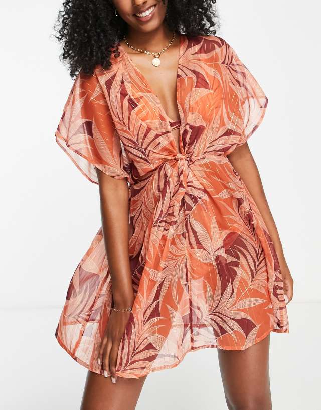 Accessorize beach kimono in tropical print