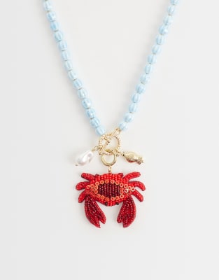 beaded crab statement necklace in blue