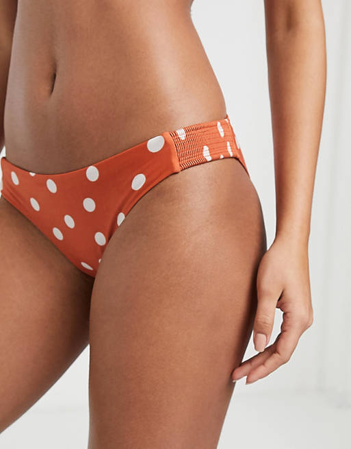 Accessorize bikini bottom with smocking detailing in polka dot