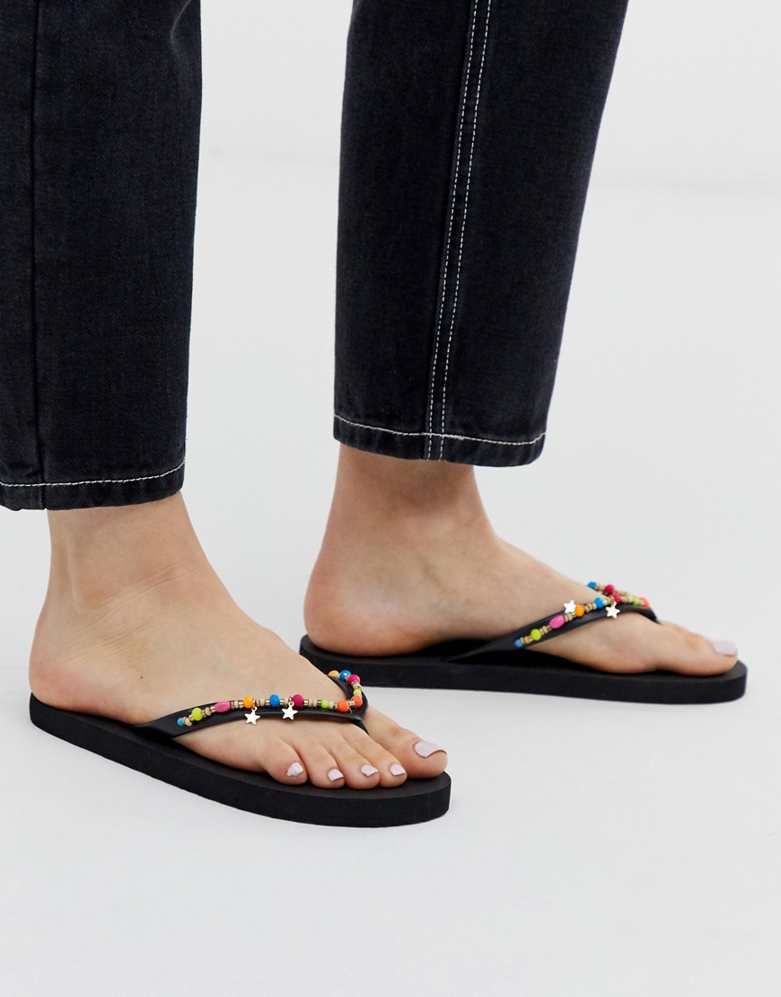Accessorize black flip flops with neon beaded trim-Multi
