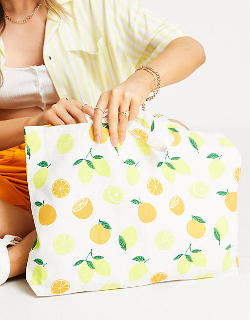 Accessorize bright shopper bag in fruit print