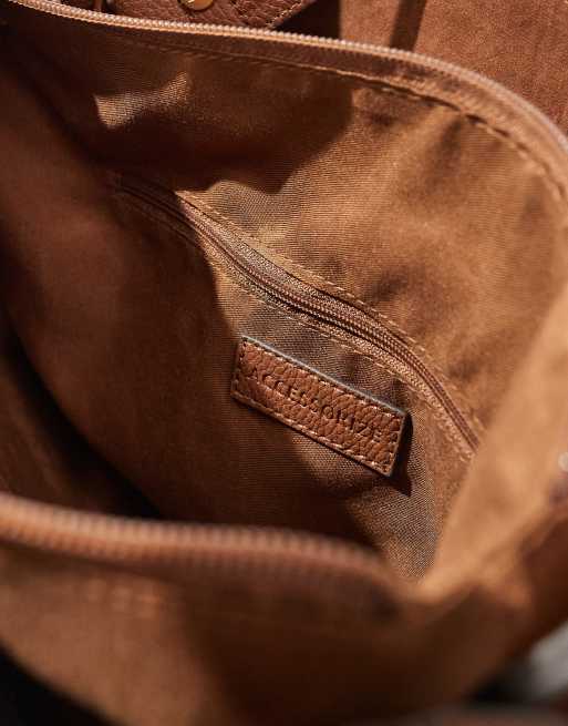 Accessorize bucket bag with faux suede in tan ASOS