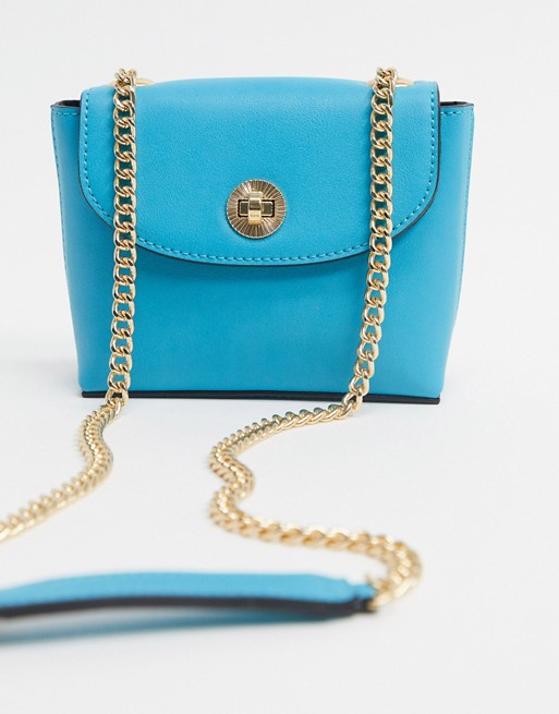 Accessorize mini crossbody bag with chain strap in bright blue