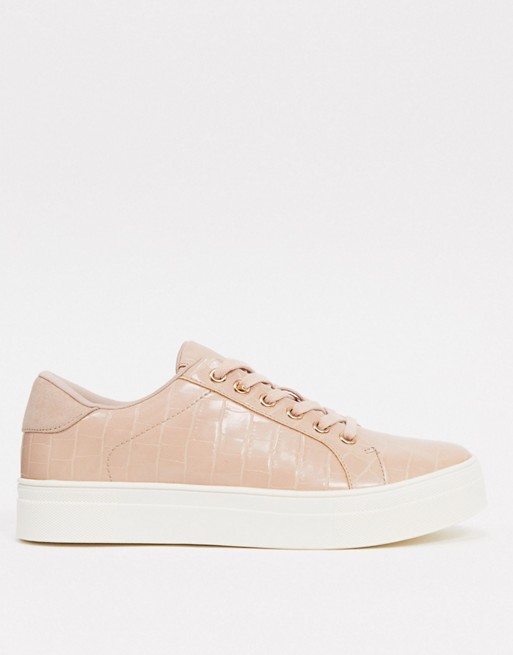 Accessorize chunky flatform trainers in pink croc with rose gold hardwear