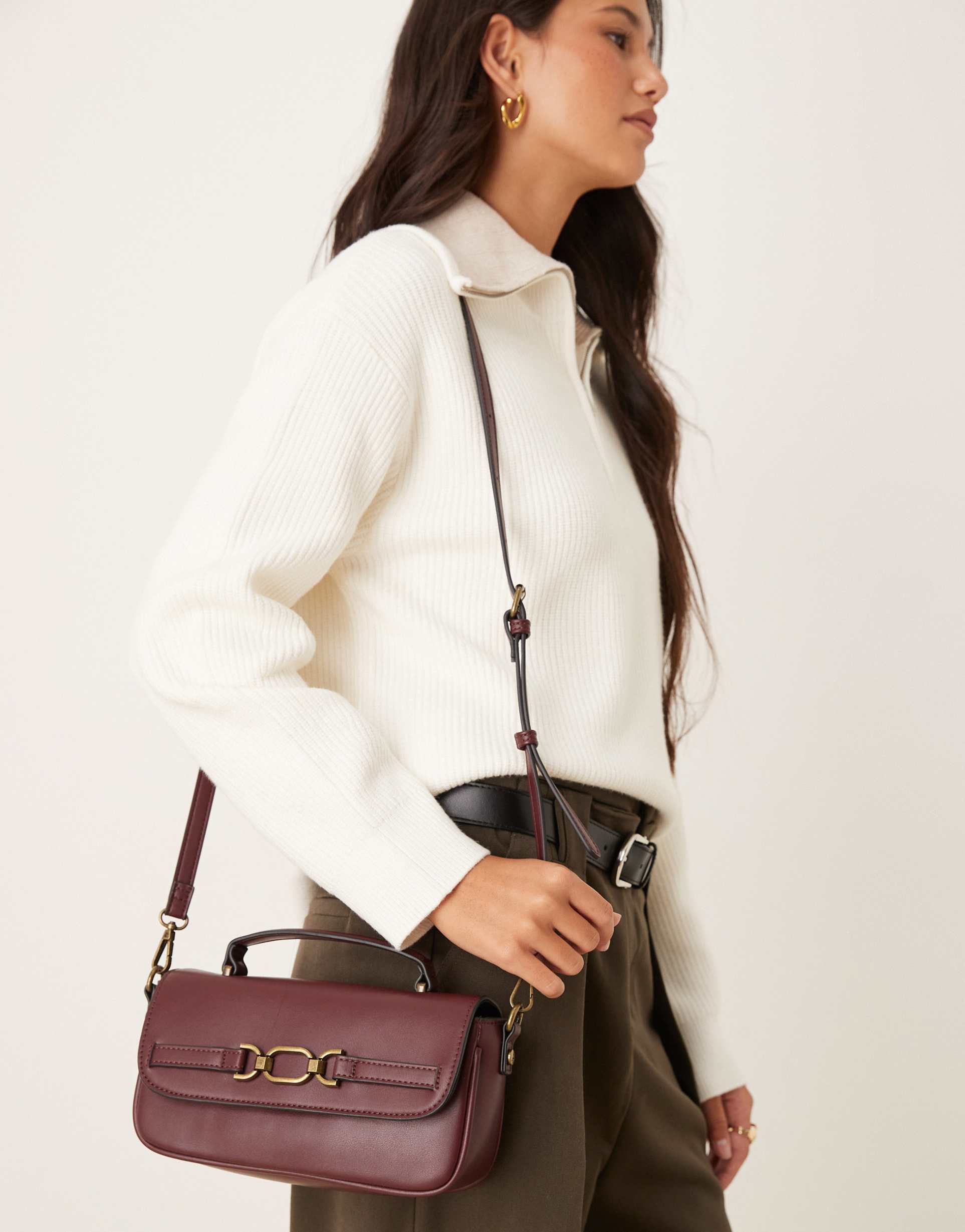 accessorize crossbody bag with gold buckle detailing in burgundy