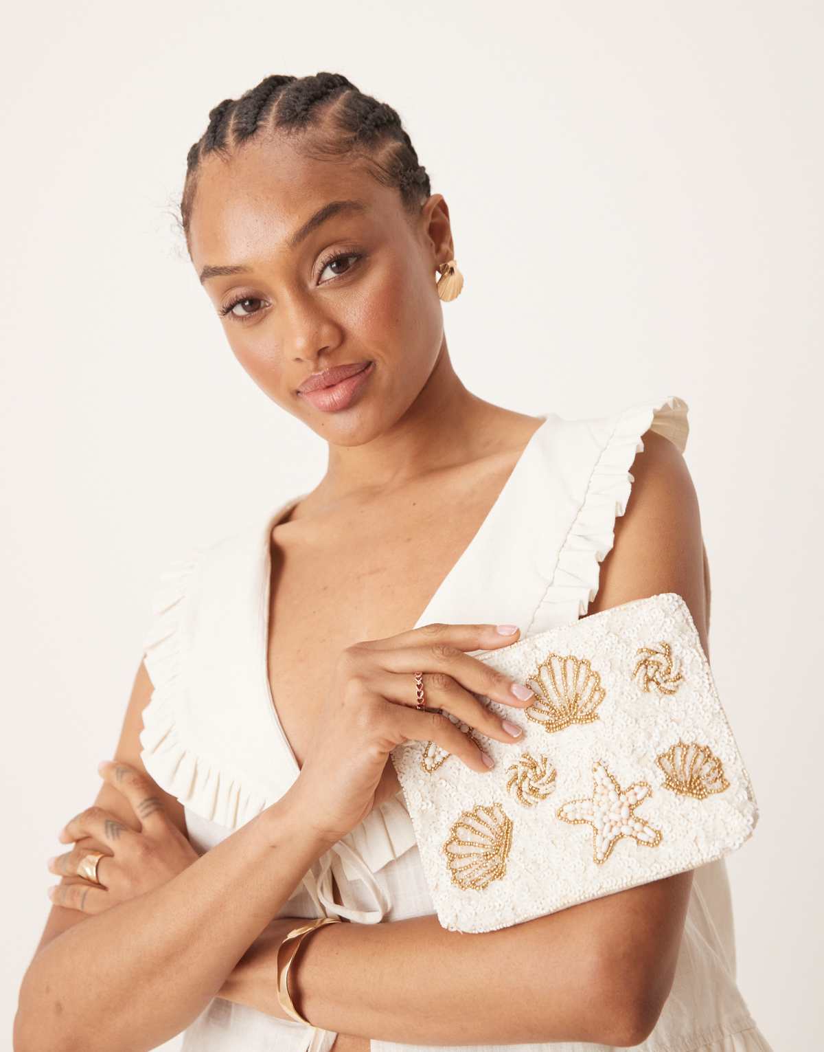 Accessorize embellished shell pouch in cream