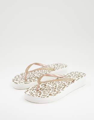 Accessorize eva flatform flip flops in gold - ASOS Price Checker