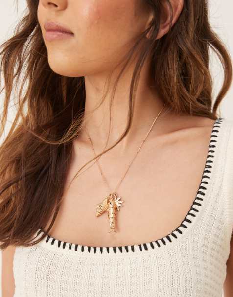 Accessorize fish charm pendant necklace in gold - view 1