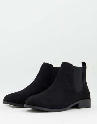 Accessorize flat ankle boots in black faux suede