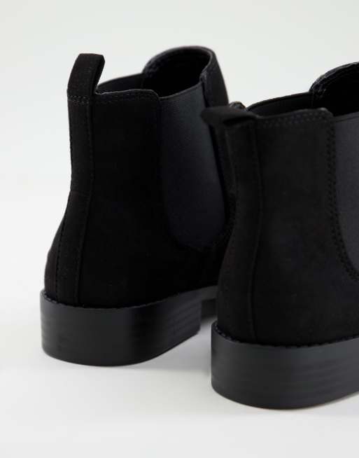 Accessorize flat ankle boots in black faux suede