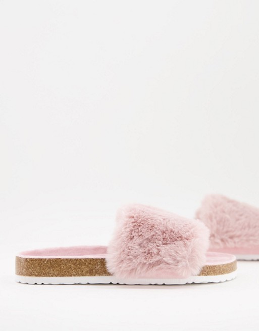 Accessorize fluffy sliders in pink