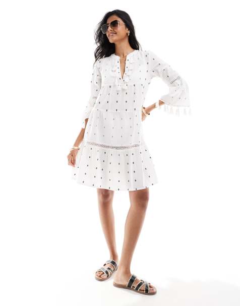 Accessorize – Gräddvit, kort strandkaftan med tofsar - view 1