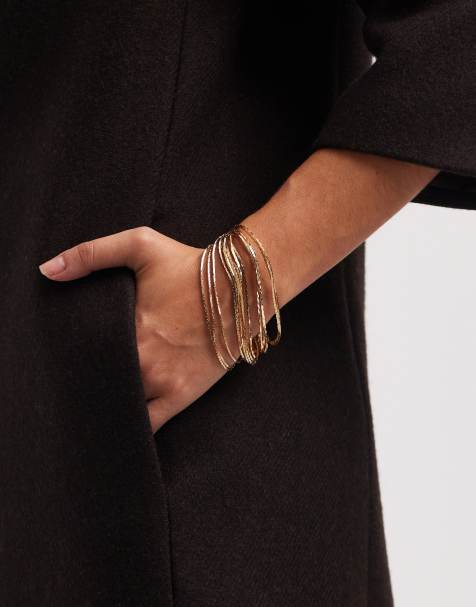 Accessorize - Guldfarvet og stramt armbånd med hængsellukning - view 1