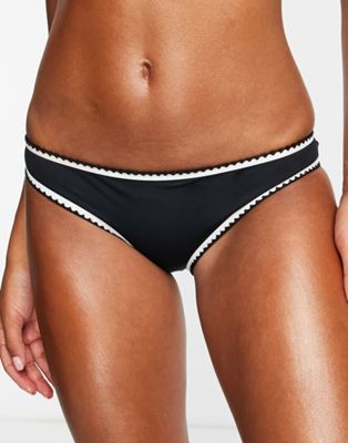 Accessorize high waist bikini bottom with contrast stitching in black