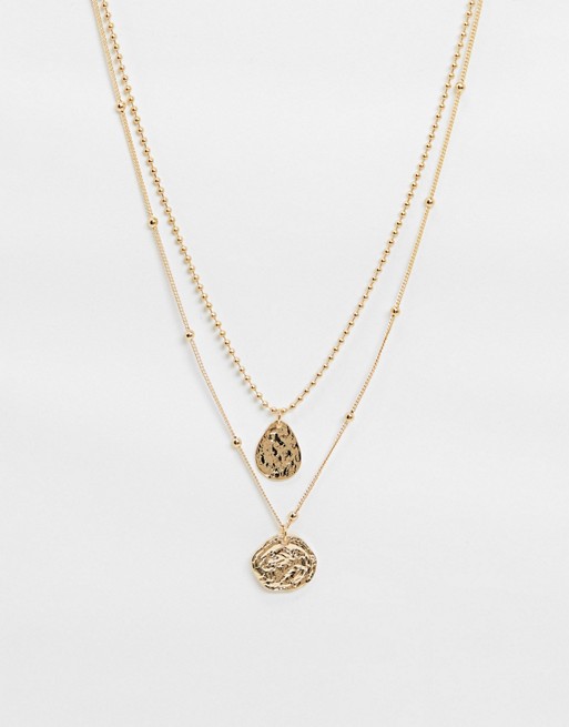 Accessorize layered necklace with circle pendant in gold