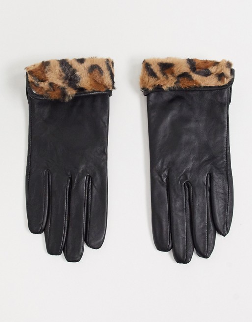 Accessorize leather gloves with faux fur leopard trim in black