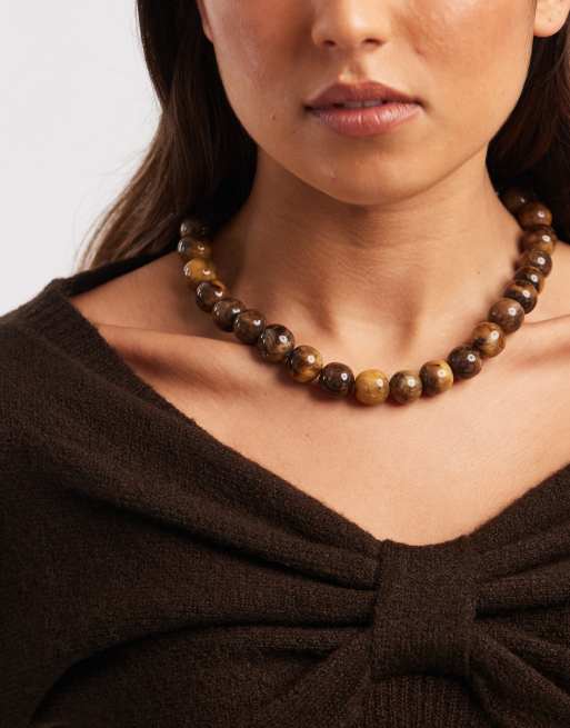 Accessorize – Naszyjnik w kolorze złota z brązowymi koralikami z tworzywa