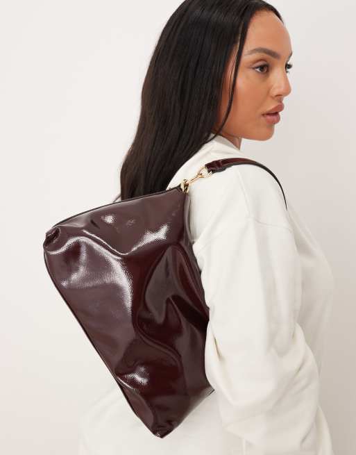 Accessorize patent slouchy handheld bag in burgundy, 2 of 4