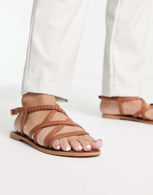 Strappy hot sale flip flops