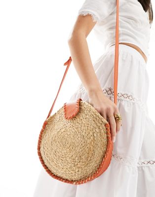 Accessorize round straw bag with orange contrast in natural